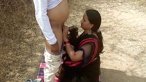 Indian brunette riding on white dick in outdoor action