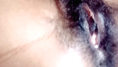 Sexy hairy girl takes off clothes and shows her pussy