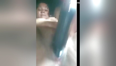 Indian blonde plays with a huge dildo in the hot sun