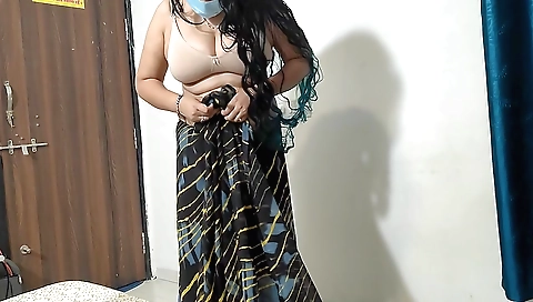 Indian amateur woman in a pink dress is in front of camera