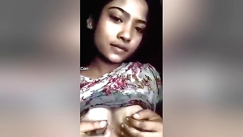 Busty indian chick shows her boobs with her fingers