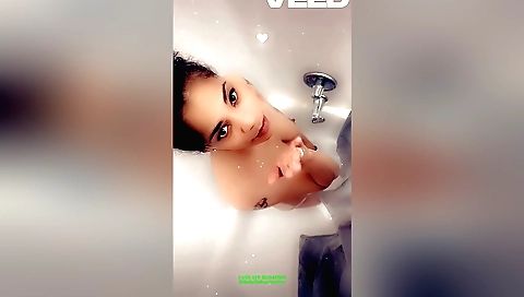 Indian girl in a bikini shows off her tits in the shower