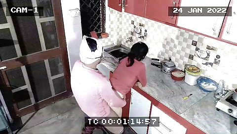 Indian babe gives him a blowjob and gets fucked in the kitchen