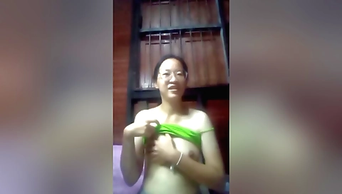 Indian woman with a pink necklace is alone in her home 0343