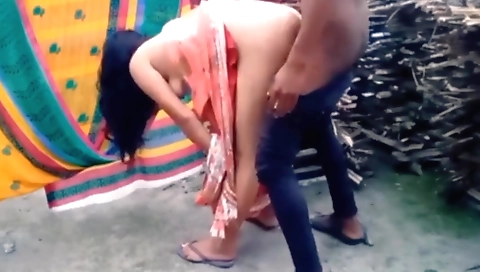 Brunette shows her small tits and pussy in the outdoor setting