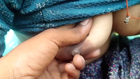Indian girl with natural skin is playing with a big pole in the field