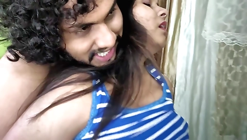 Indian woman and her boyfriend are playing in the shower