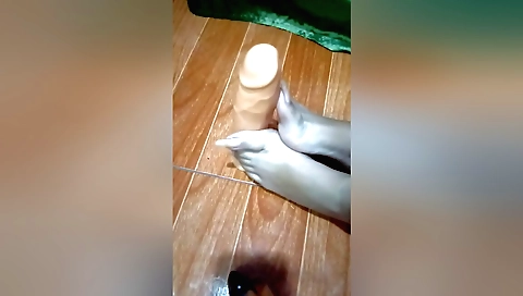 I'm using a huge dildo on my feet in a homemade solo video