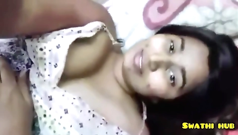 Slutty brunette in a black outfit is filming video