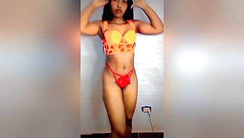 Sexy brunette in red dress is showing off her body