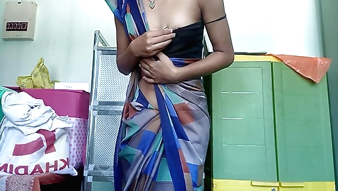 Indian beauty is riding her feet at the black sari