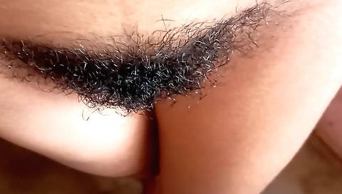 Indian hairy girl shows her hairy pussy in her camera