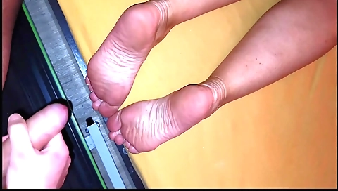 Hot brunette masturbates with feet in foot fetish video